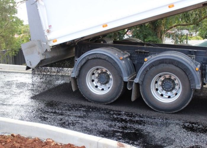 Nexpave truck laying asphalt and bitumen.