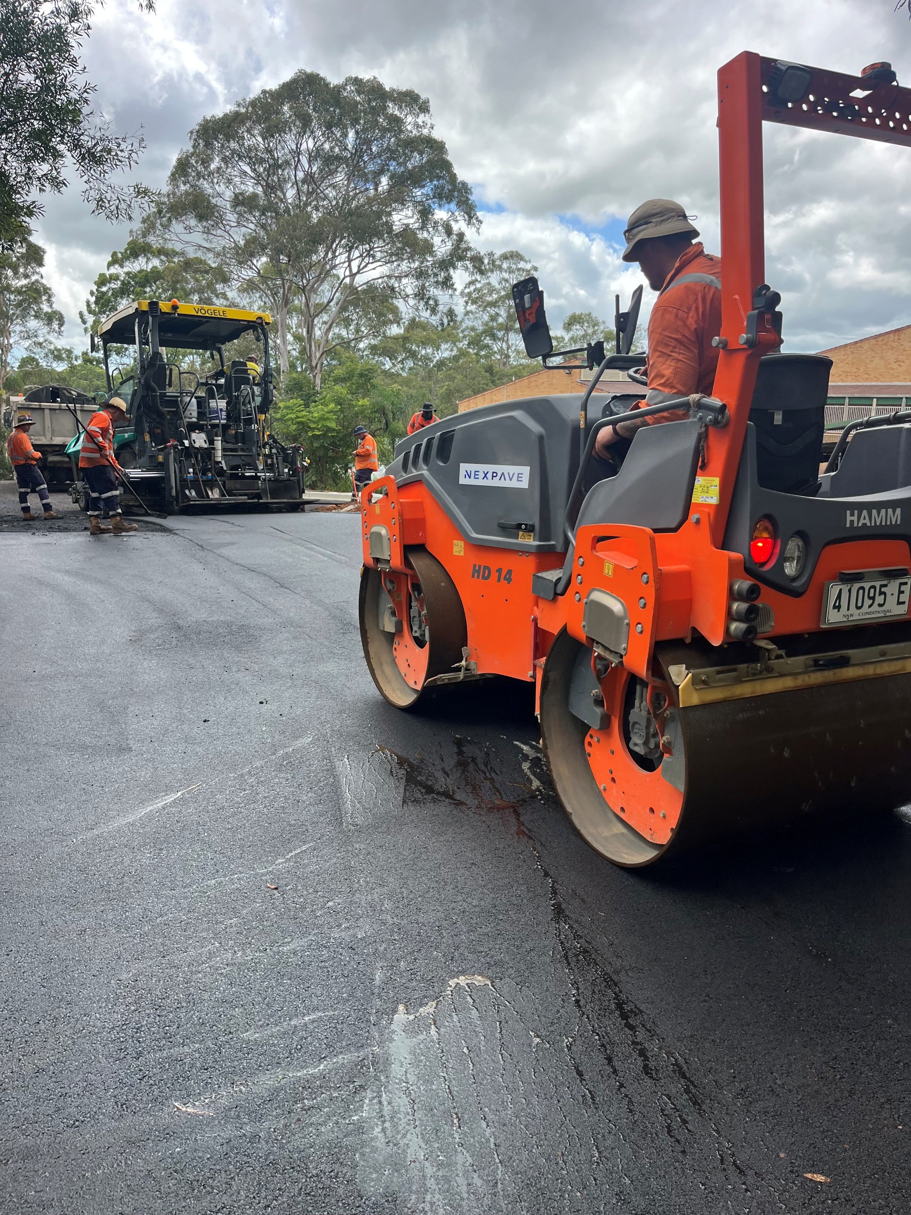 Nexpave team member operating an asphalt roller on a civil roads work site in the Northern Rivers region.